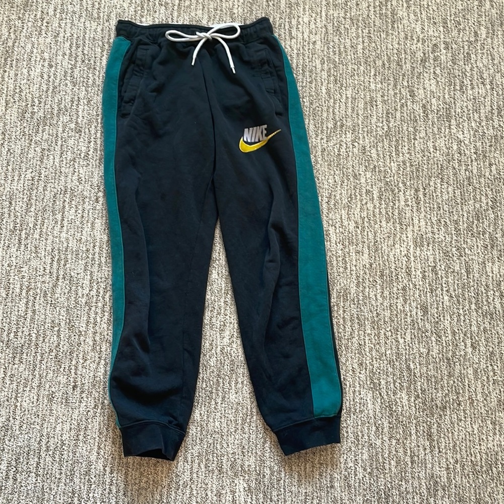 Black and green Nike sweats